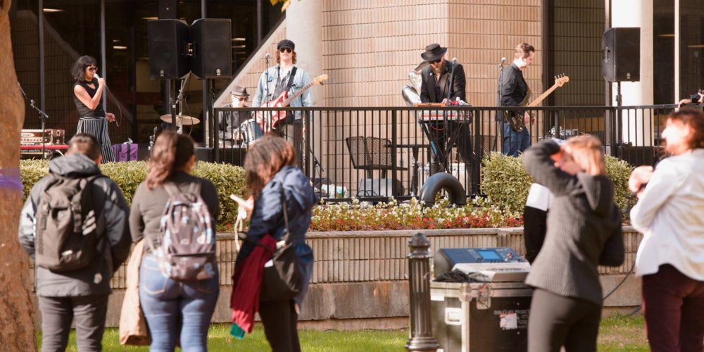 Shilpa Ray and her band performing on Norman Samuels Plaza for Dedication Day.