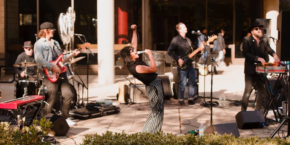 Shilpa Ray and her band performing on Norman Samuels Plaza for Dedication Day.