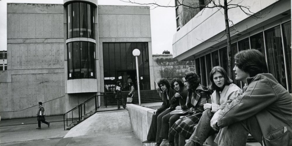 Students sitting in front of Hill Hall (April 1973)